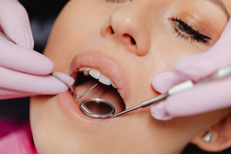 Patient smiling during a visit at Well Beyond Dental